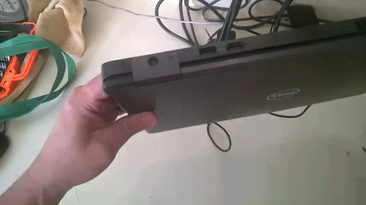 How to plug in a laptop power cable.